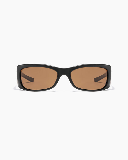 SABOTAGE sunglasses with matte black frame and bronze polarized lenses shown in a close up front view