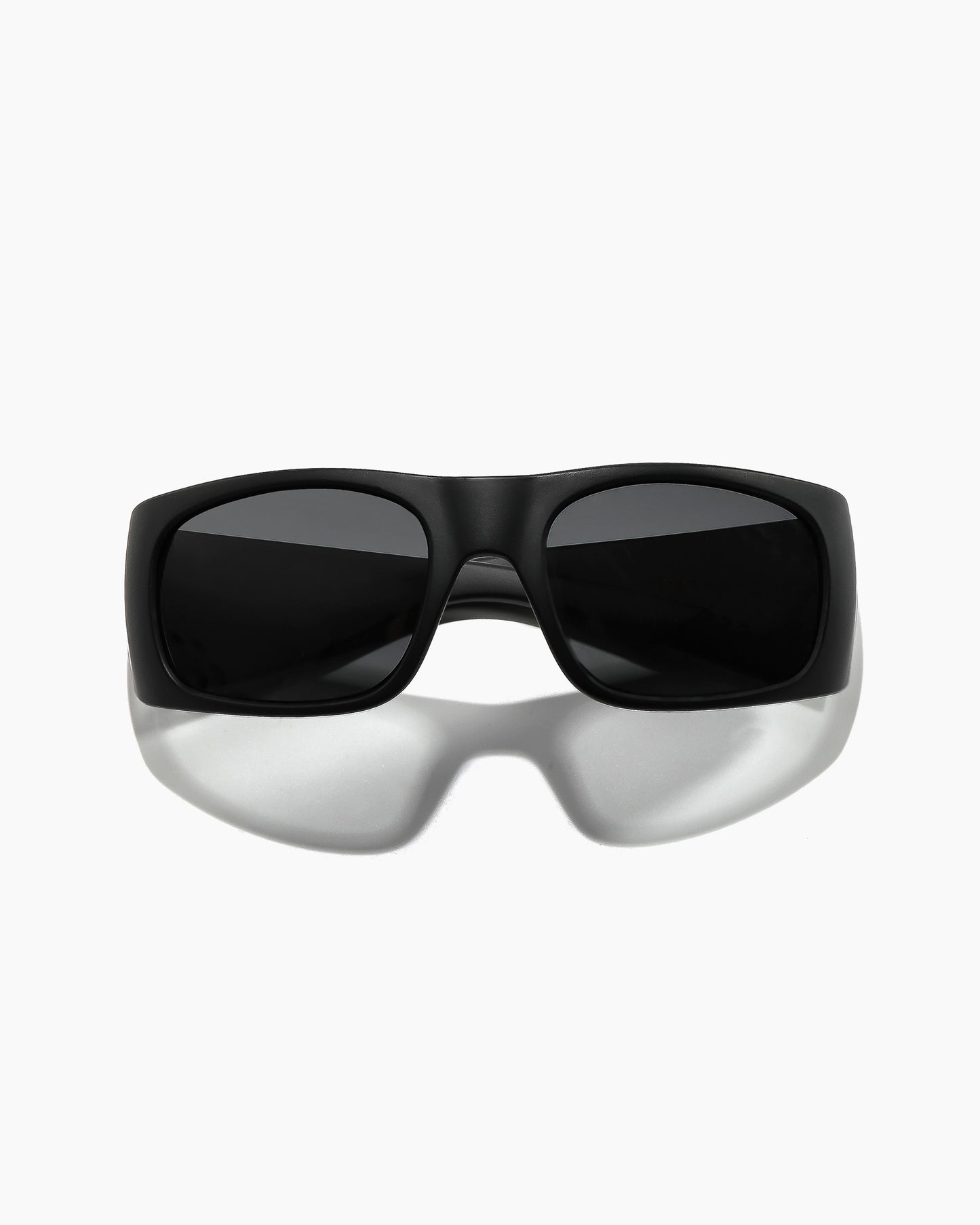 Transmitter sunglasses by Noa Deane in matte black with polarized lenses, front view from a lower angle