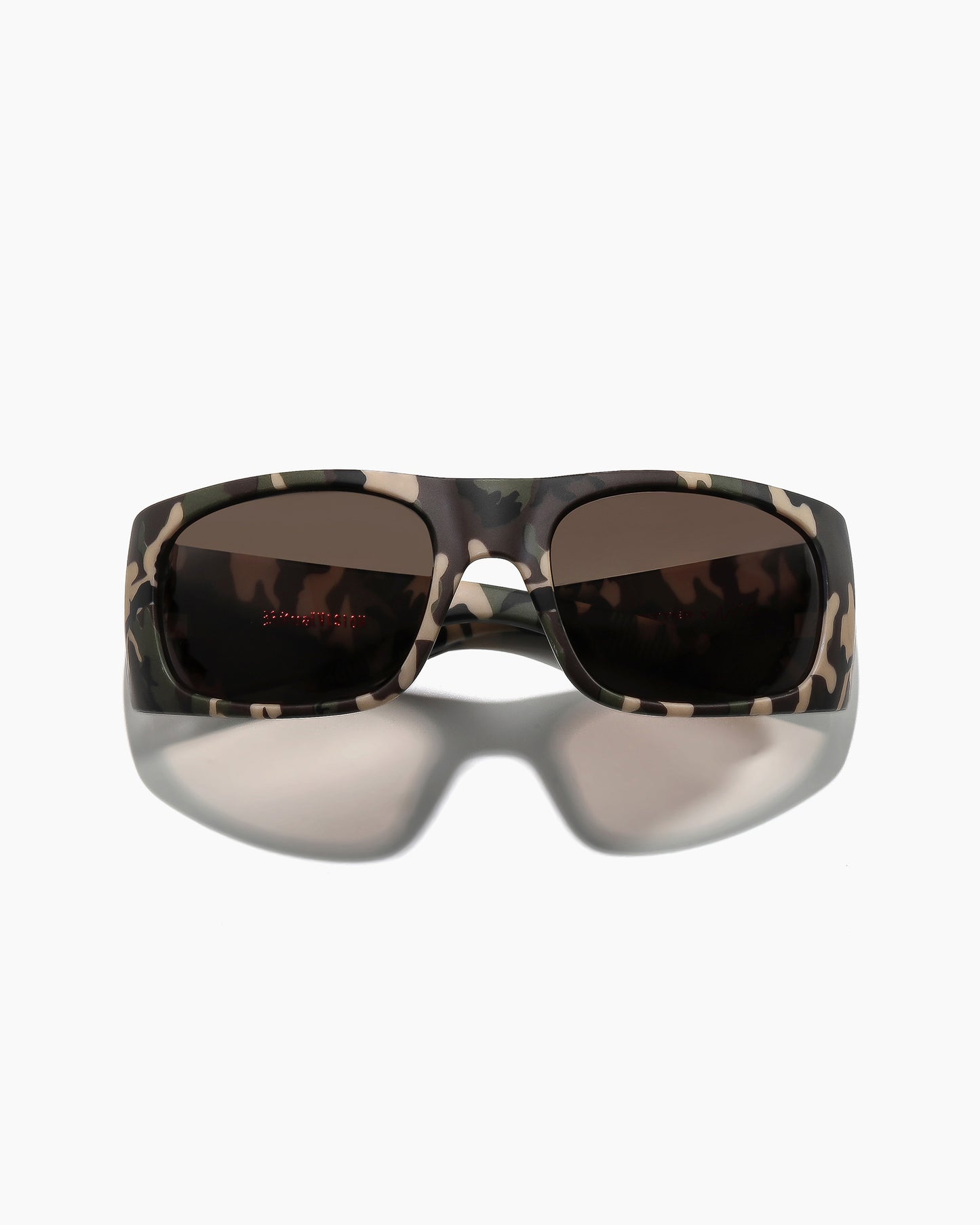 Transmitter sunglasses by Noa Deane in matte camo frame with dark green polarized lenses angled view