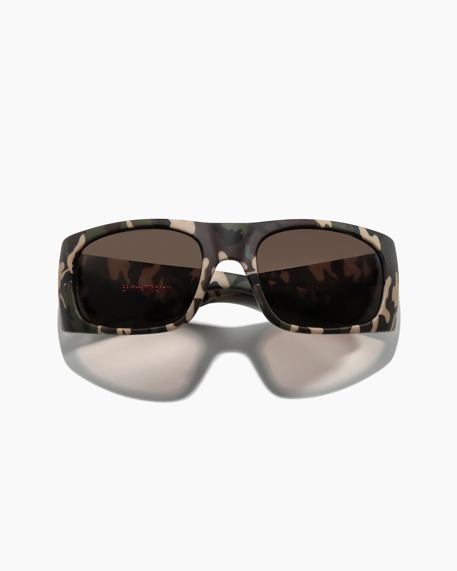 Transmitter sunglasses by Noa Deane in matte camo frame with dark green polarized lenses angled view