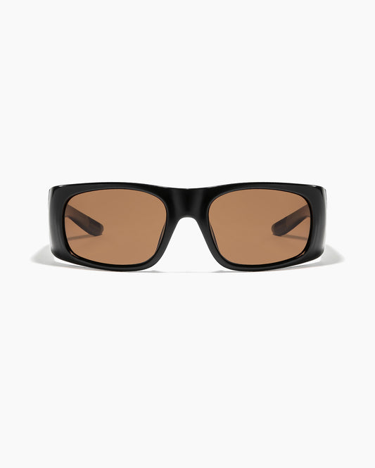 Transmitter sunglasses by Noa Deane in polished black frame with bronze polarized lenses.